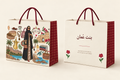 Bint Oman printed paper gift bag with burgundy rope handles