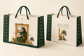 Omani Women's Day printed paper gift bag with green rope handles